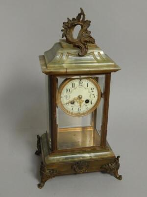 A late 19thC French onyx brass and ormolu four glass mantel clock