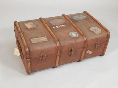 A 20thC canvas and stained wood bound trunk