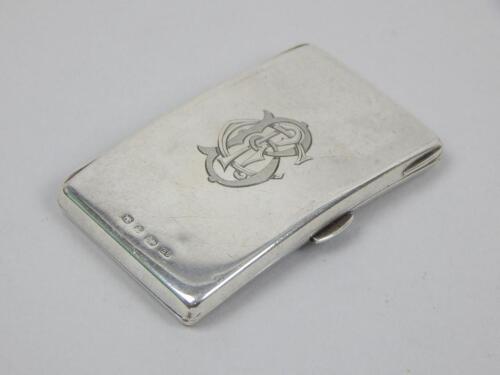 A shaped rectangular late Victorian silver stamp and card case