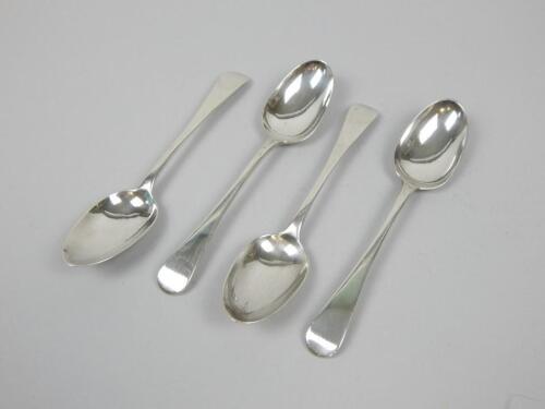 A set of four George III Old English pattern Scottish silver dessert spoons