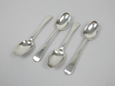 A set of four George III Old English pattern Scottish silver dessert spoons