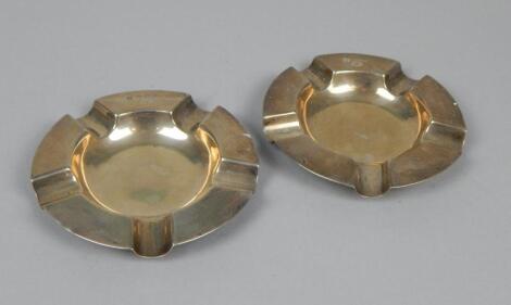 A pair of Edwardian Asprey silver ashtrays