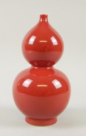 A Chinese Sang De Boeuf glazed double gourd shaped vase