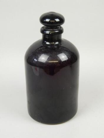 A 19thC purple tinted glass jar and cover