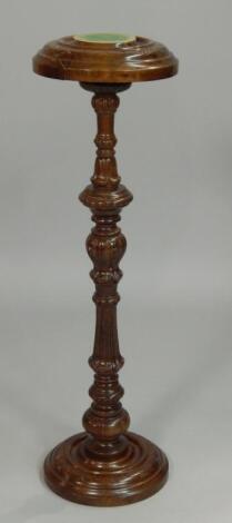 A Victorian style carved walnut plant stand