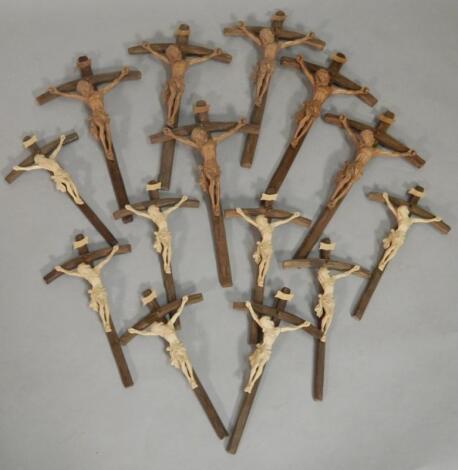 A collection of carved wooden crucifixes