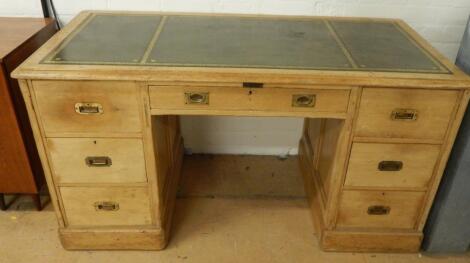 A Victorian pine kneehole desk