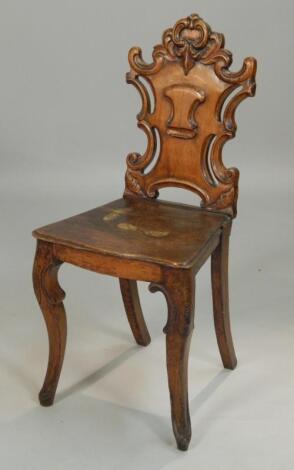 A Victorian carved oak hall chair