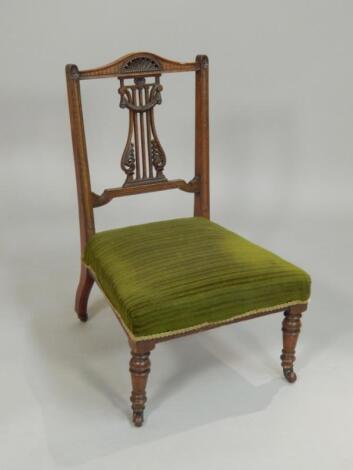 A Victorian walnut nursing chair