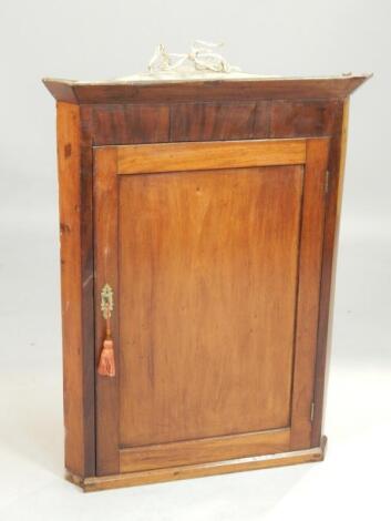 A 19thC mahogany corner cabinet