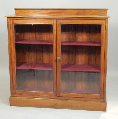 An Edwardian walnut display cabinet