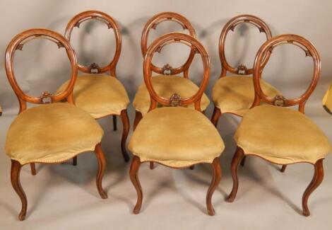 A set of six Victorian walnut balloon back chairs