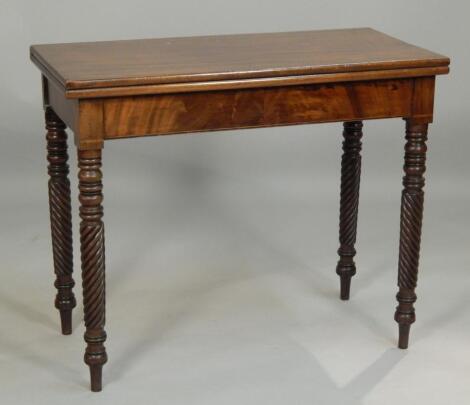 An early 19thC mahogany tea table