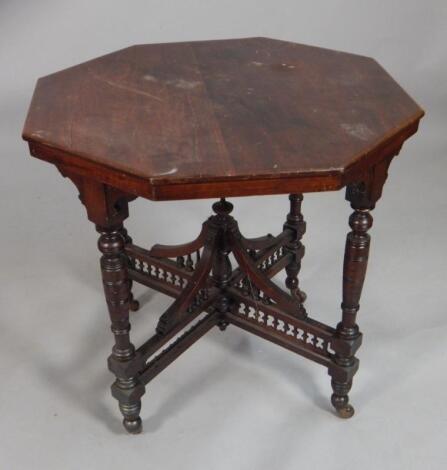 An Edwardian walnut occasional table