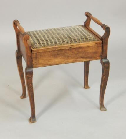 An Edwardian mahogany piano stool