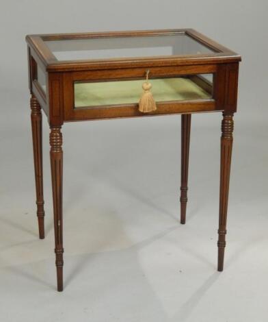 An Edwardian style mahogany display table