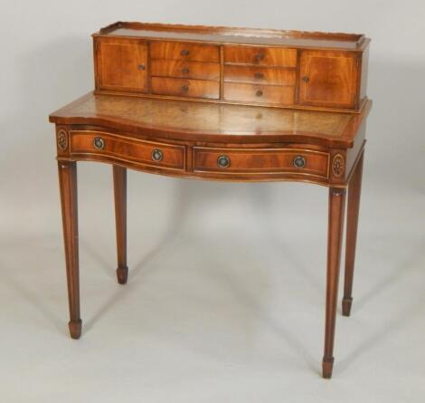 A reproduction mahogany ladies writing desk