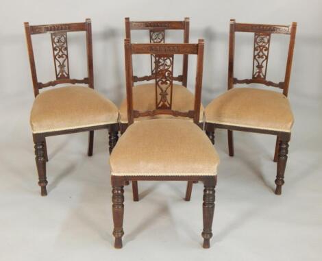 Four Edwardian walnut dining chairs