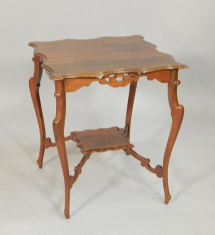 An Edwardian walnut occasional table