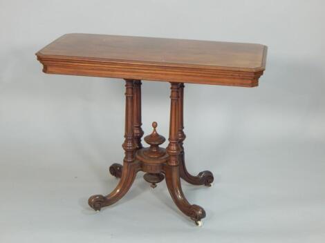 A Victorian walnut card table