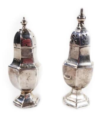 A pair of matched silver cruet shakers