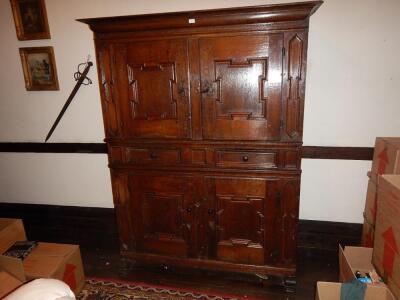 An early 17thC oak press cupboard