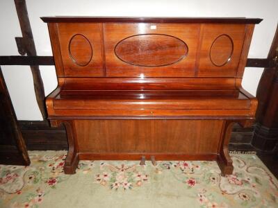 A 1920's Lechleiter upright overstrung piano in a walnut case.