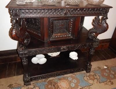 A Jacobean style oak credenza