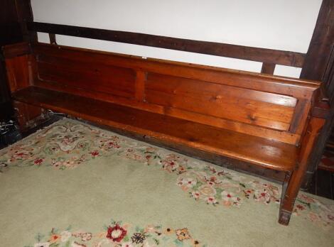 A Victorian Gothic style pine church pew