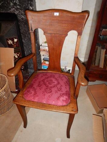 An early 20thC oak open armchair