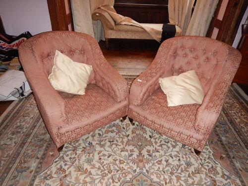 A pair of late Victorian low upholstered tub chairs