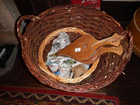 A set of oak bellows and two log baskets.