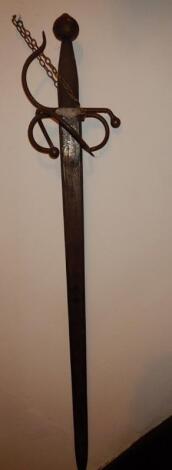 An ornamental broad sword and a brass horn.