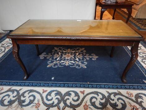 A reproduction mahogany coffee table