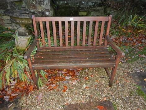 A wooden slatted garden bench seat