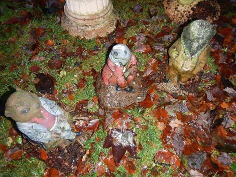 Three coloured stone Wind in The Willow garden figures.