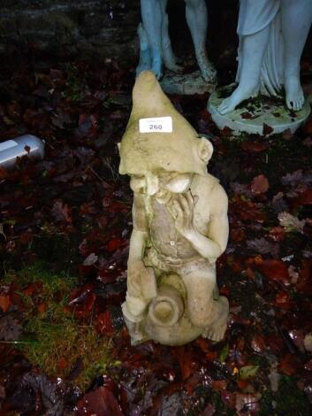 A reconstituted stone pixie garden ornament