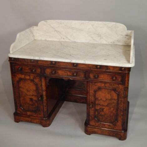 A Victorian walnut and ash kneehole wash stand