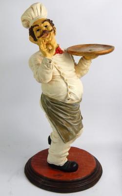 A plaster Restaurant advertising figure