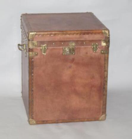 A reproduction leatherette storage trunk