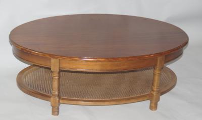 A teak oval coffee table