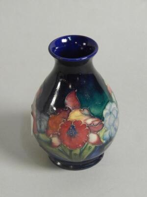 A Moorcroft Orchid pattern baluster vase