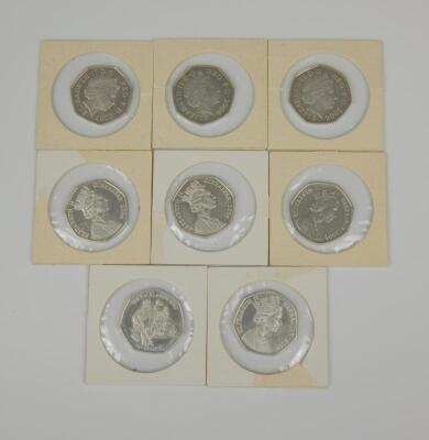 Eight silver 50 pence coins