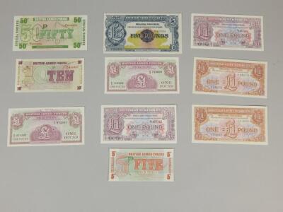 A collection of various Armed Forces bank notes