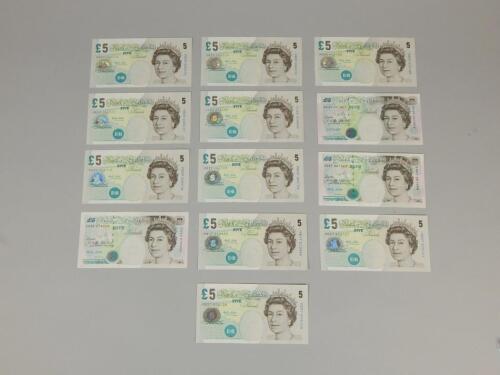 A collection of fifteen £5 notes