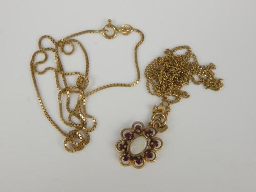 A floral pendant and chains