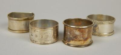 Four various silver napkin rings