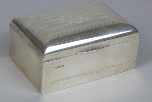 A rectangular silver and cedar lined cigarette box