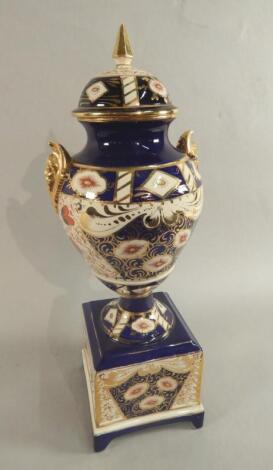 A late 19thC Staffordshire Pottery Imari vase and cover