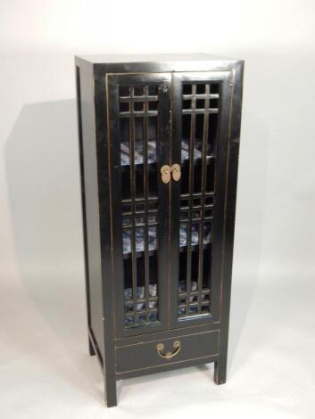 An oriental style black lacquered style cabinet